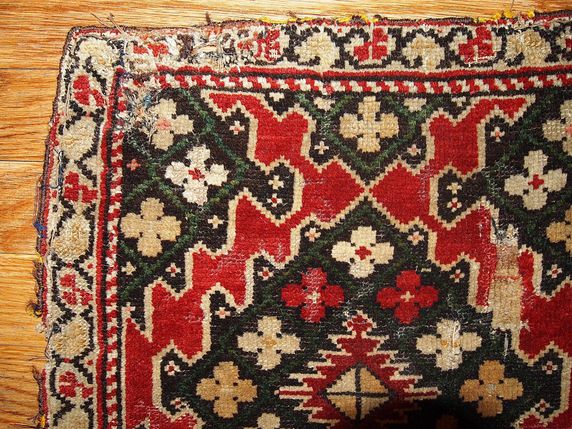 The pair of Armenian Karabaghs  in bright red color and beige borders. The darker shades of the rugs are not completely matchable: on one of them it has grass green color covering chocolate brown field and on another piece it is bright blue.