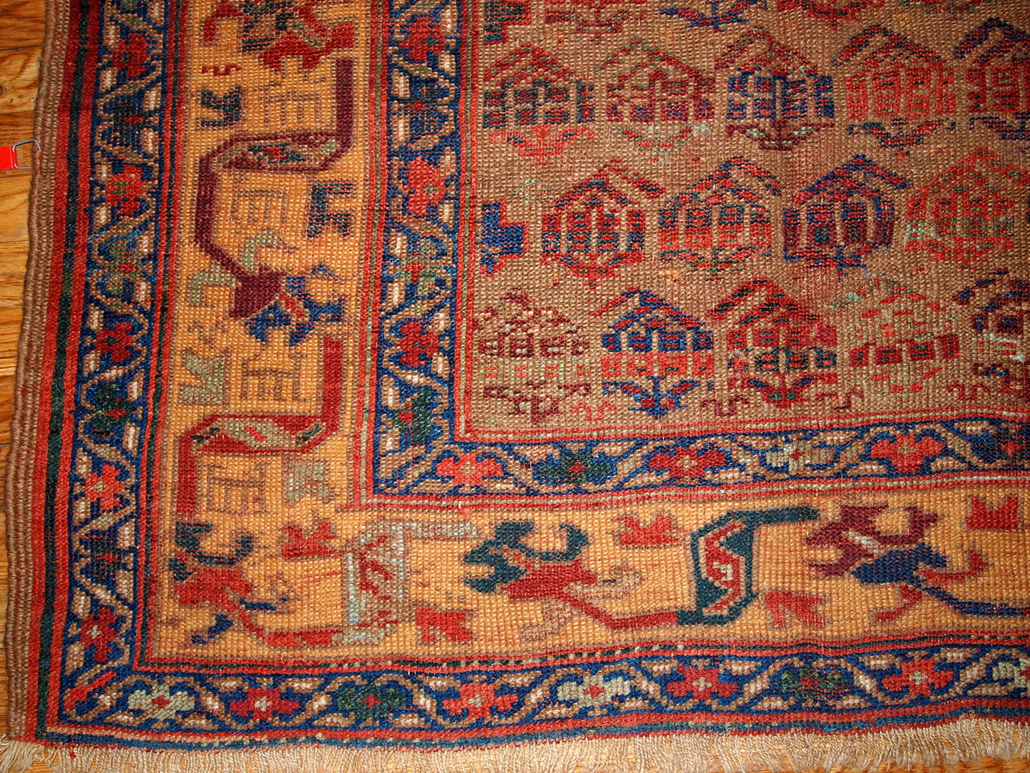 Antique Persian Kurdish rug in traditional design, olive green and yellow shades. The rug is from the end of 19th century, in good condition