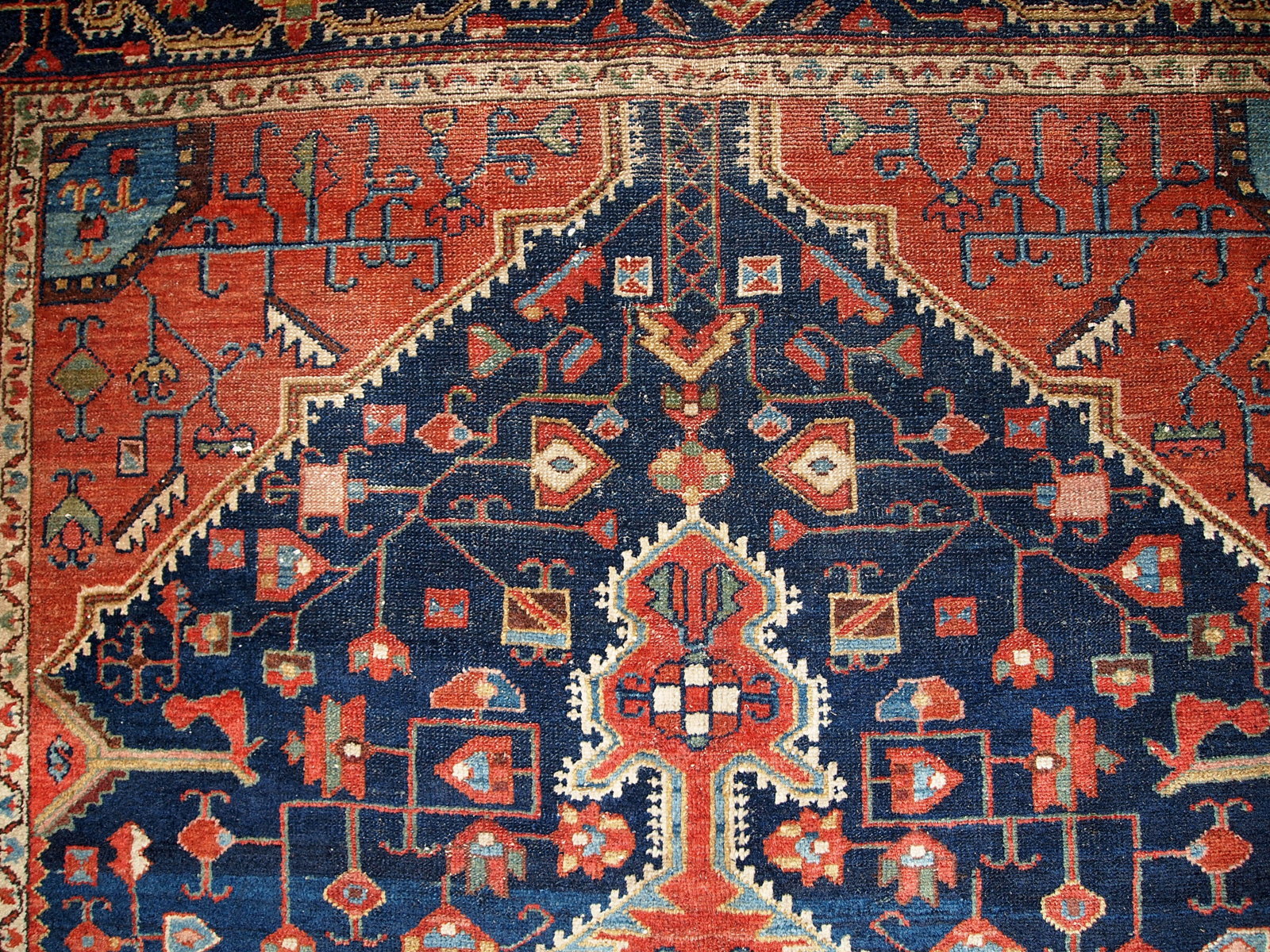 Antique handmade Malayer rug in navy blue and red shades. This rug is in original good condition.