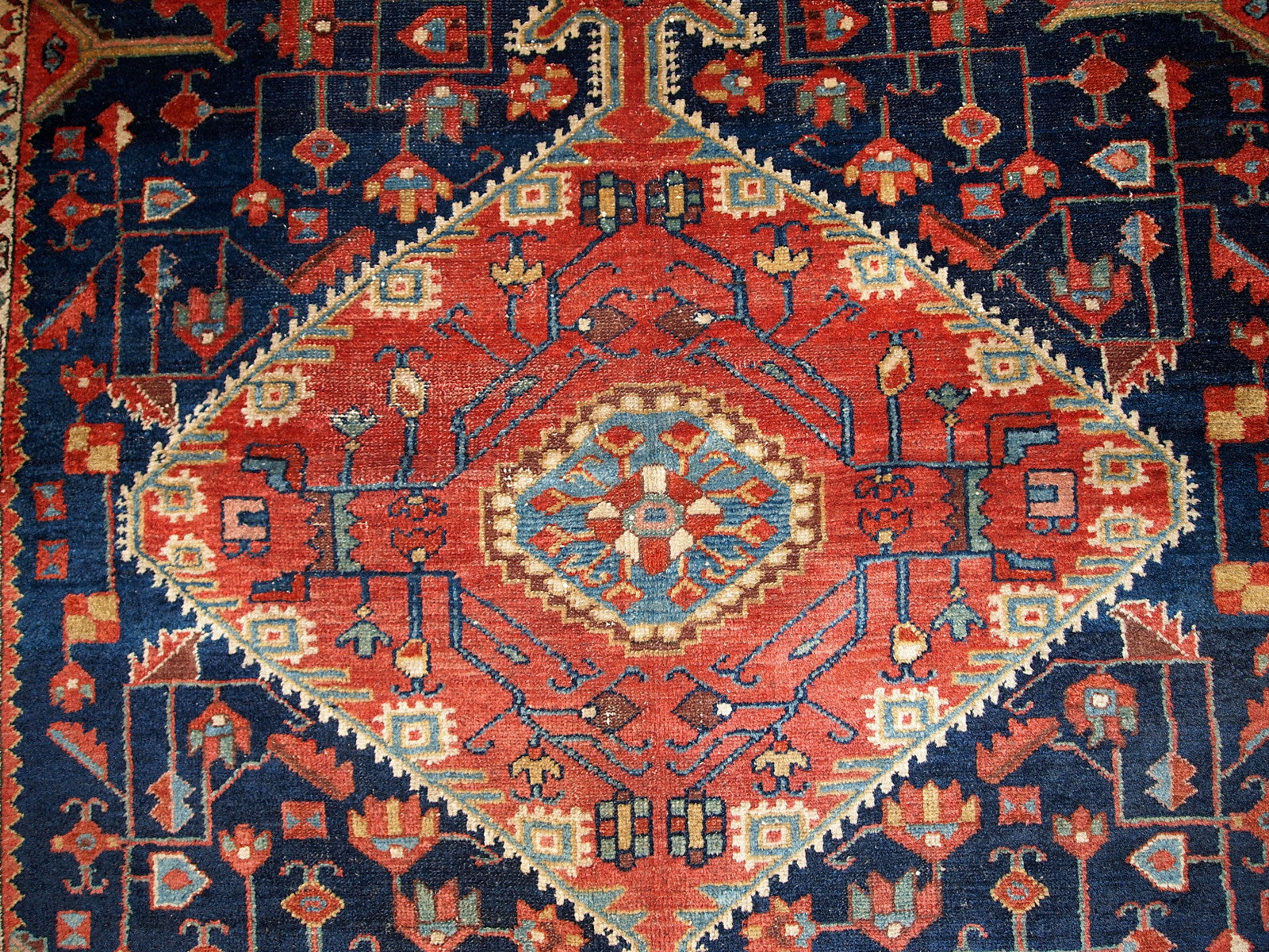 Antique handmade Malayer rug in navy blue and red shades. This rug is in original good condition.