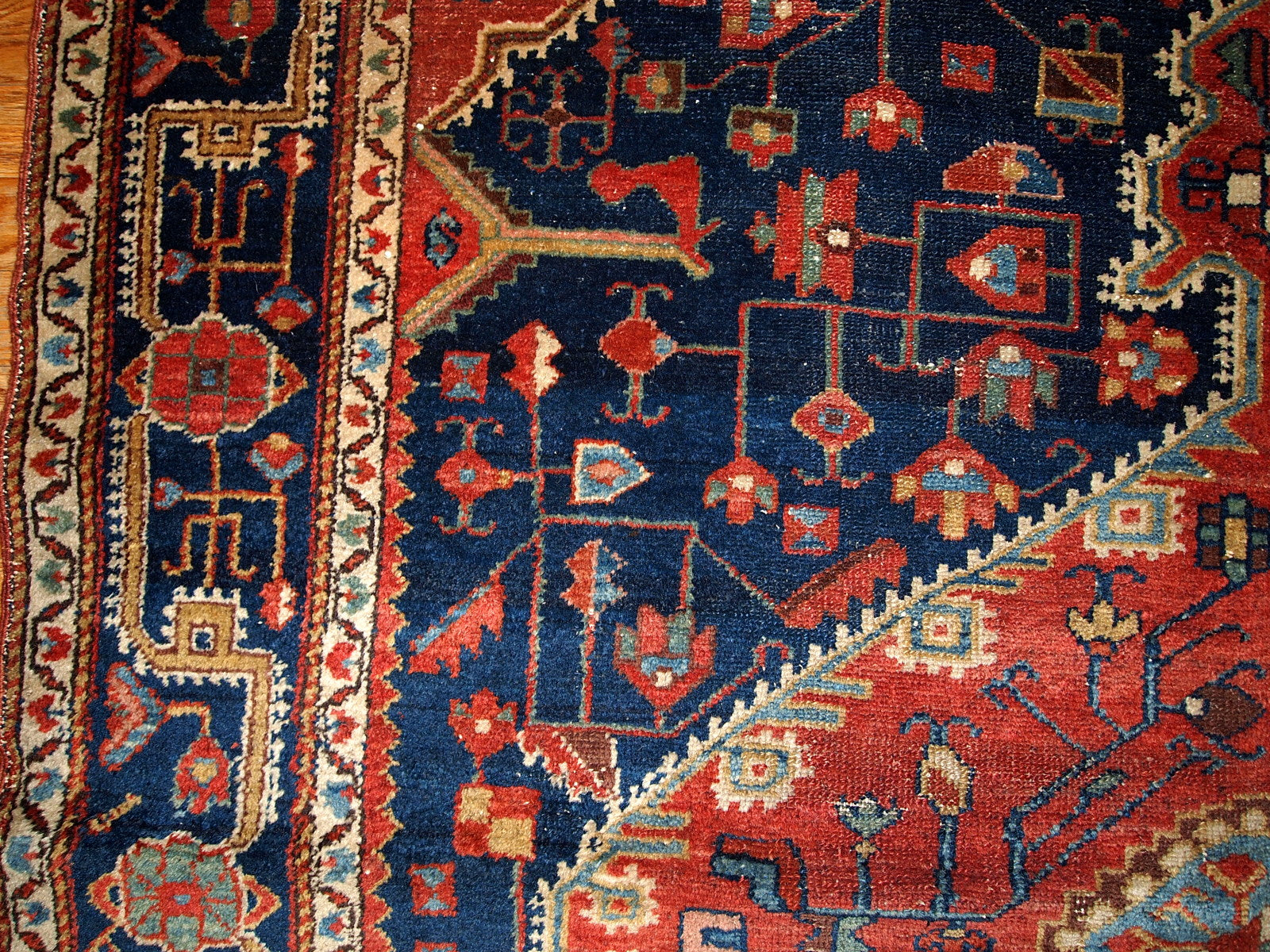 Antique handmade Malayer rug in navy blue and red shades. This rug is in original good condition.