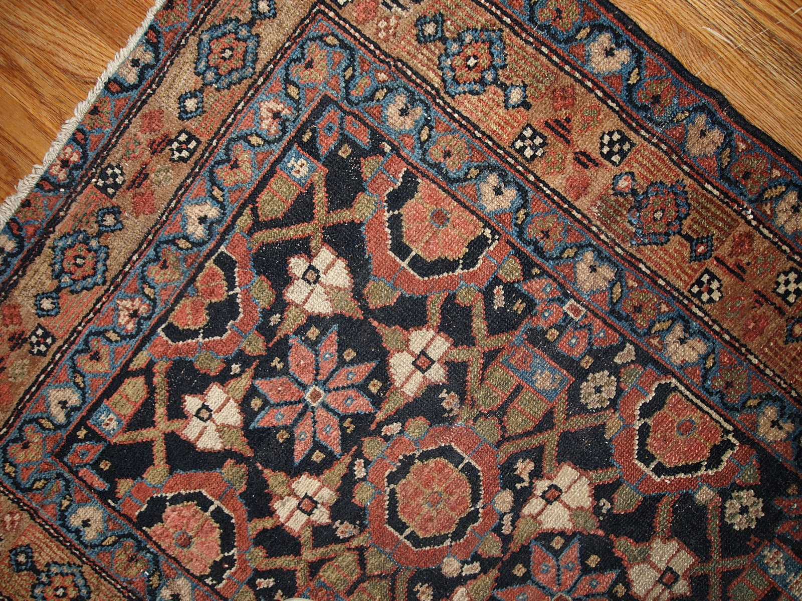 Antique Persian Hamadan runner in good original condition. This rug is in black and red shades.