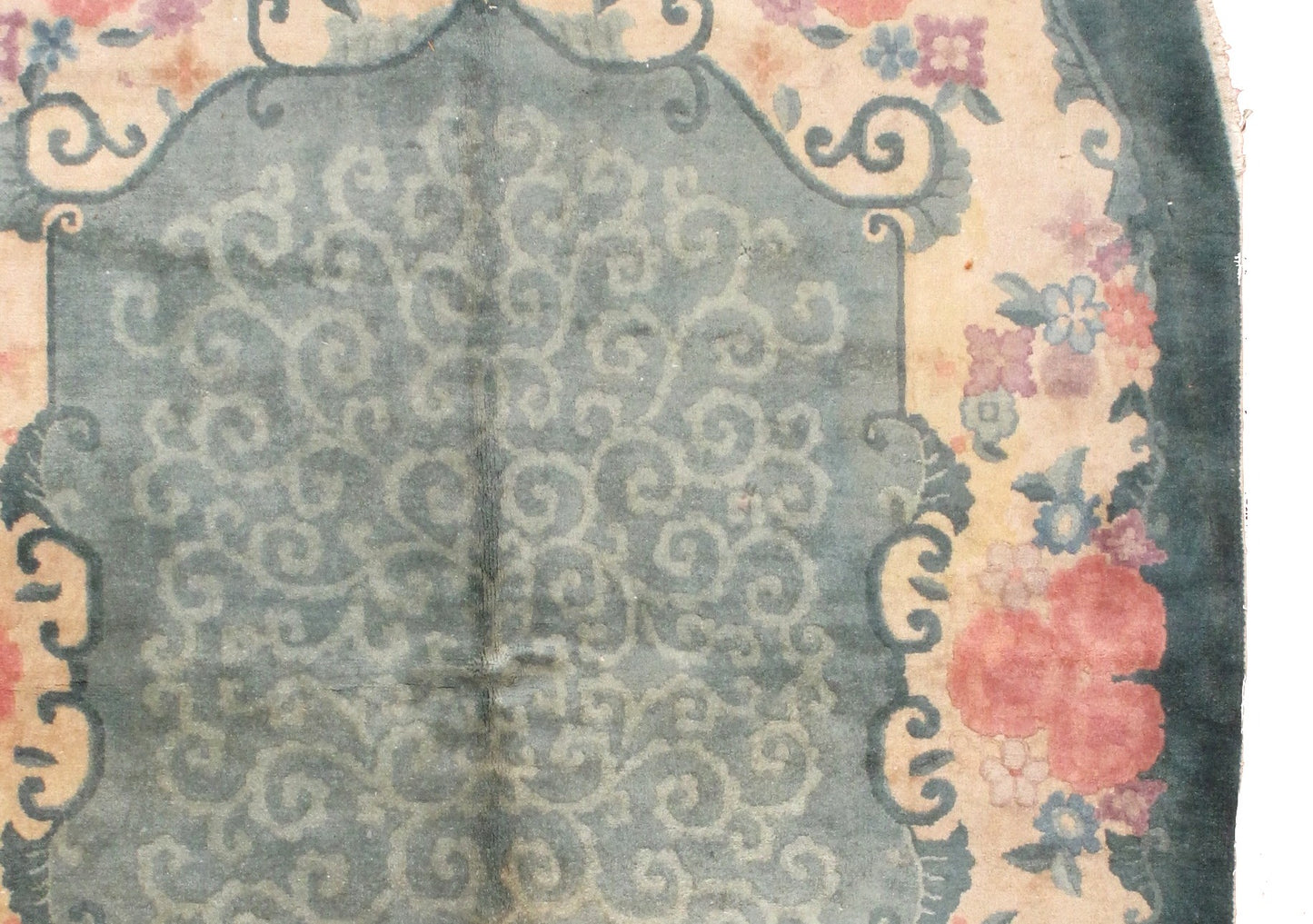 Oval Art Deco Chinese rug in original good condition. The rug is in green, rose and beige shades.