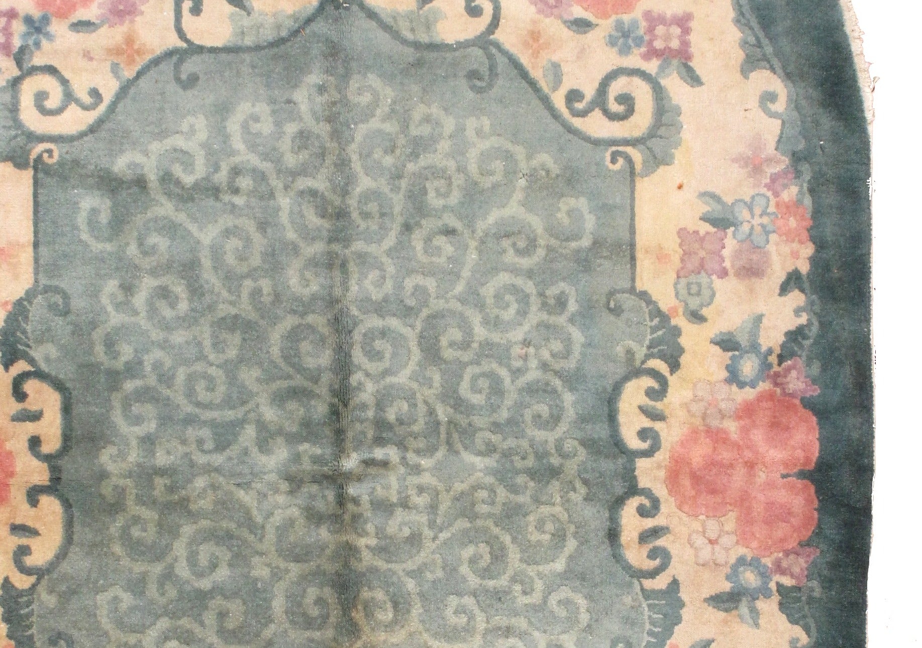 Oval Art Deco Chinese rug in original good condition. The rug is in green, rose and beige shades.