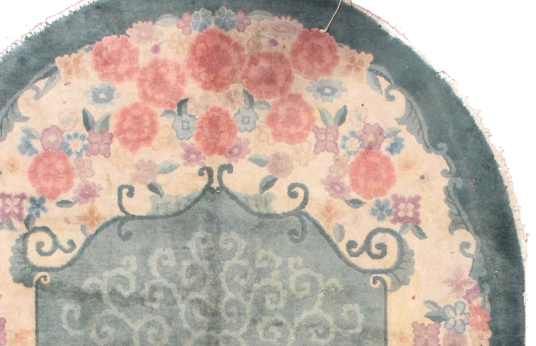 Oval Art Deco Chinese rug in original good condition. The rug is in green, rose and beige shades.