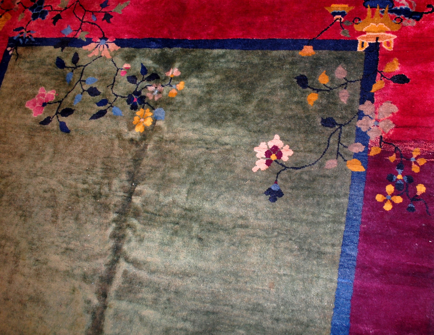 green woolen rug with flowers
