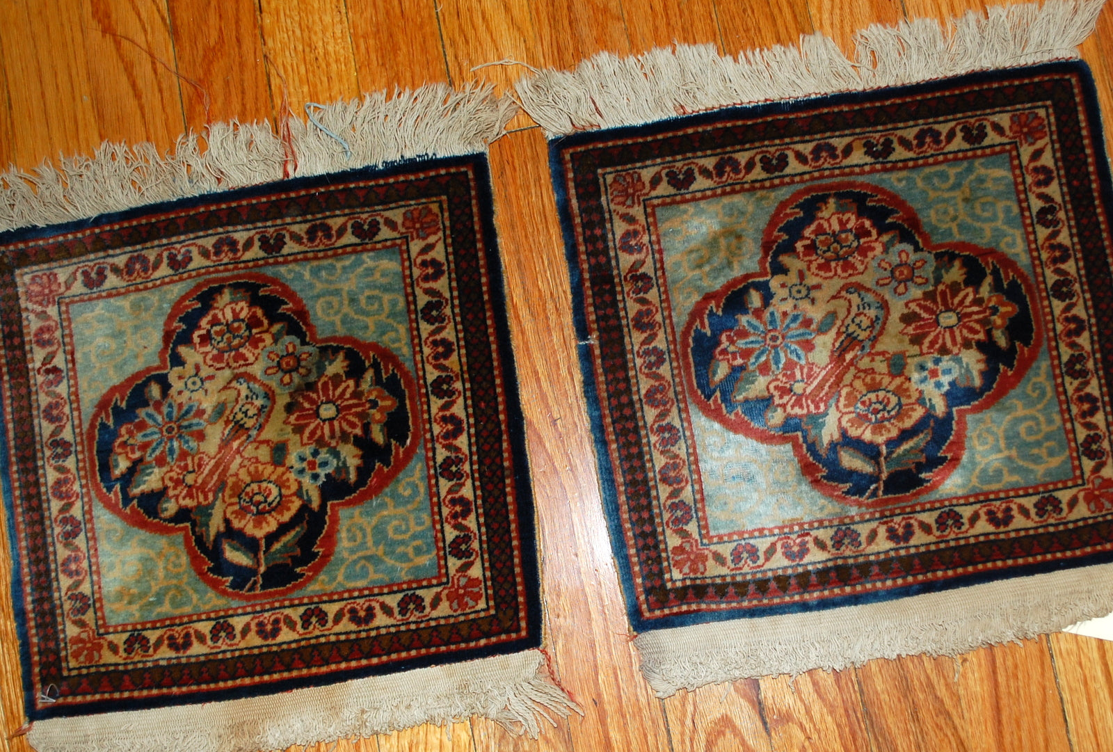 Hand made pair of antique Persian collectible Dabir Kashan rugs in original good condition. The rugs has classy Dabir Kashan design with medallion in the shape of four petals flower and the bird in it surrounded by flowers. 
