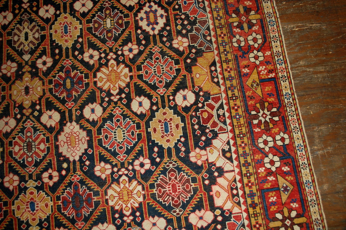 Antique hand made Russian Karabagh rug in good condition. The rug is from the end of 19th century, made in black and red wool.
