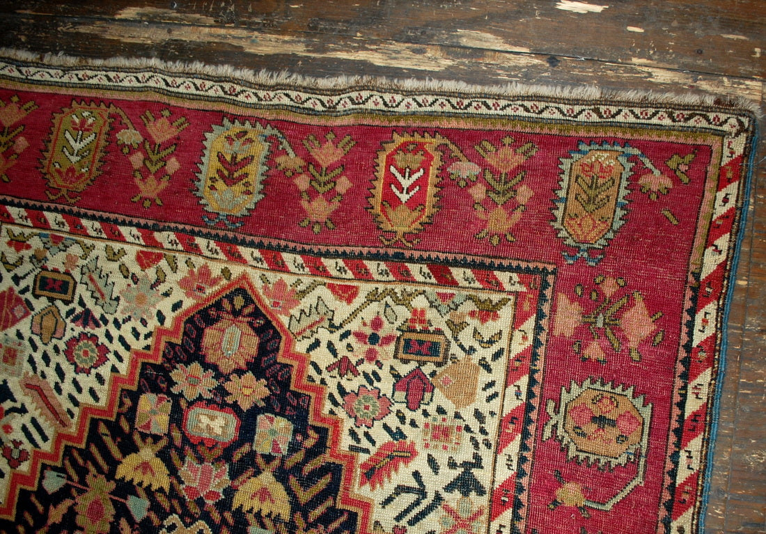 Antique hand made Armenian Karabagh rug in good condition. The rug has been made in the end of 19th century in black and pink wool.