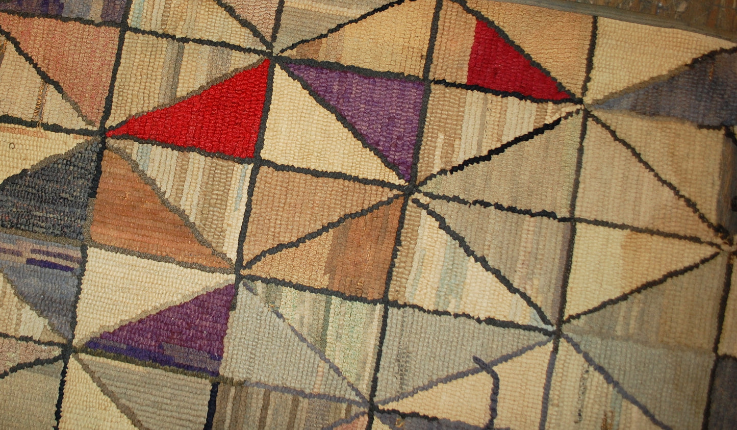 Handmade antique square American hooked rug in good condition. The rug has been made in the end of 19th century in USA in geometric design and colorful shades. 