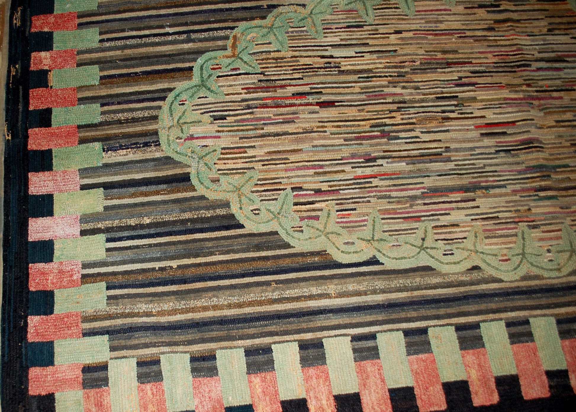 Handmade antique American hooked rug in good condition. The rug has been made in geometric design in the end of 19th century in USA.