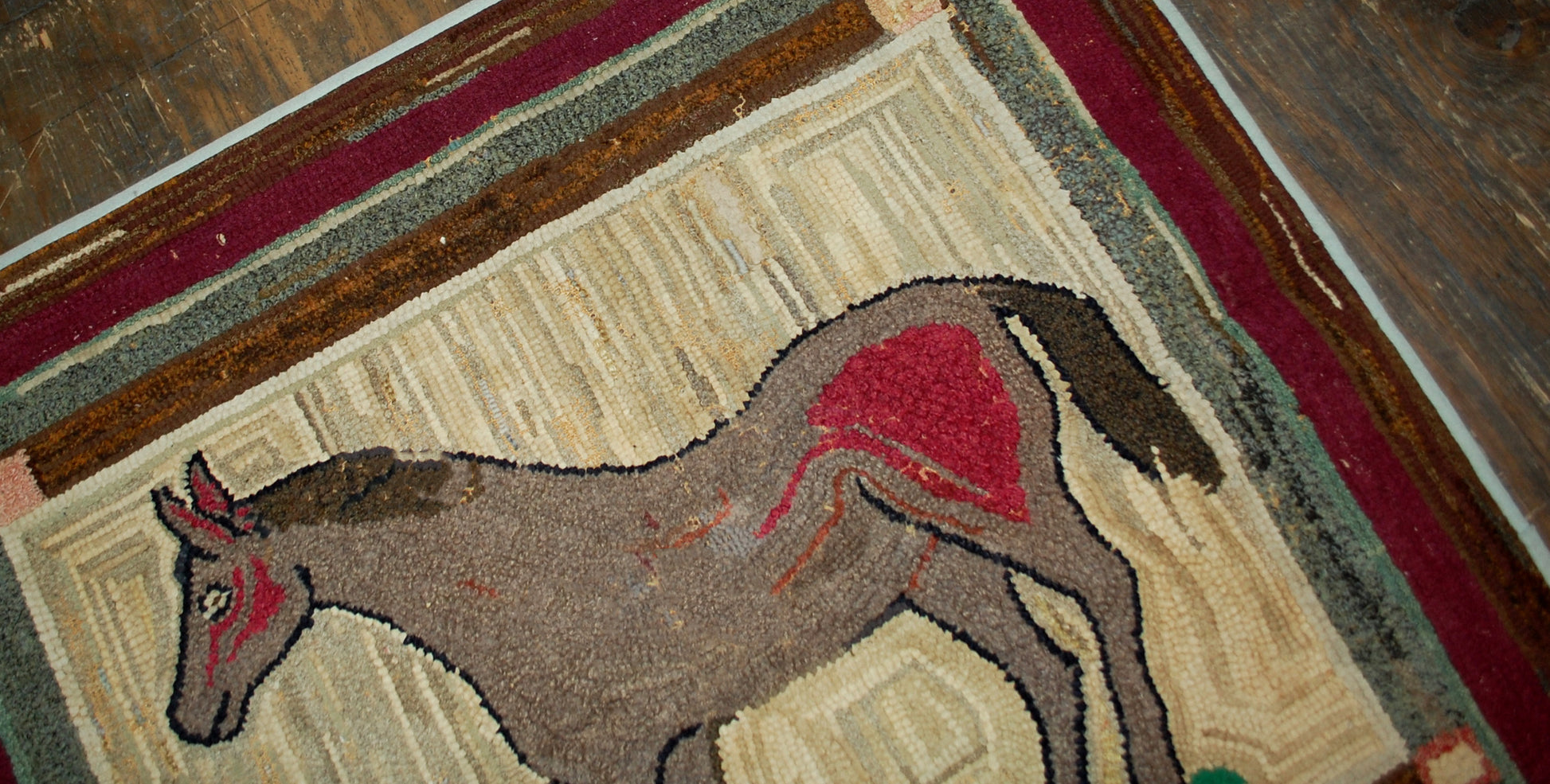 Handmade antique square American hooked rug in good condition. The rug has been made in in square shape with an image of the grey horse in the end of 19th century.