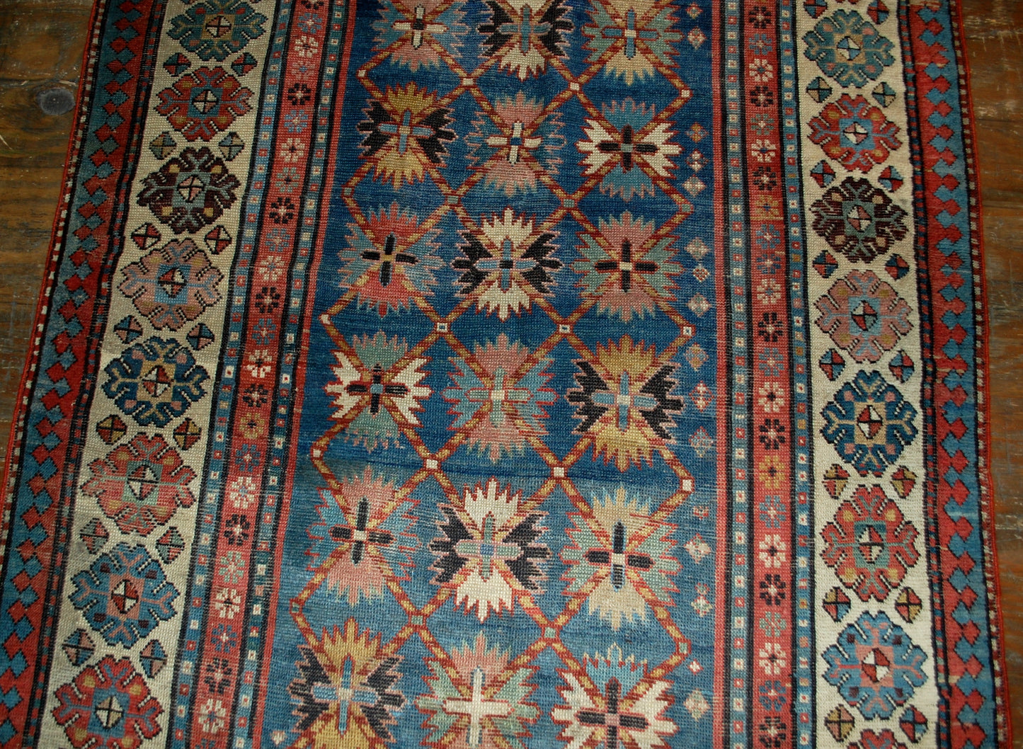Antique handmade Caucasian Talish rug in good condition. The rug is in blue and white shades, made in the end of 19th century in Russia.