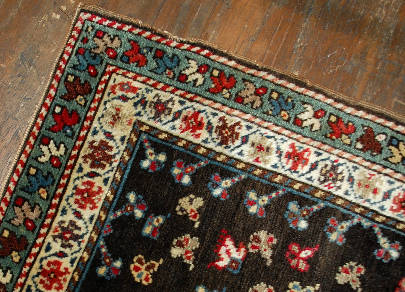 Antique handmade Caucasian Gendje rug in good condition. The rug made in chocolate brown and azure shades in the end of 19th century. 