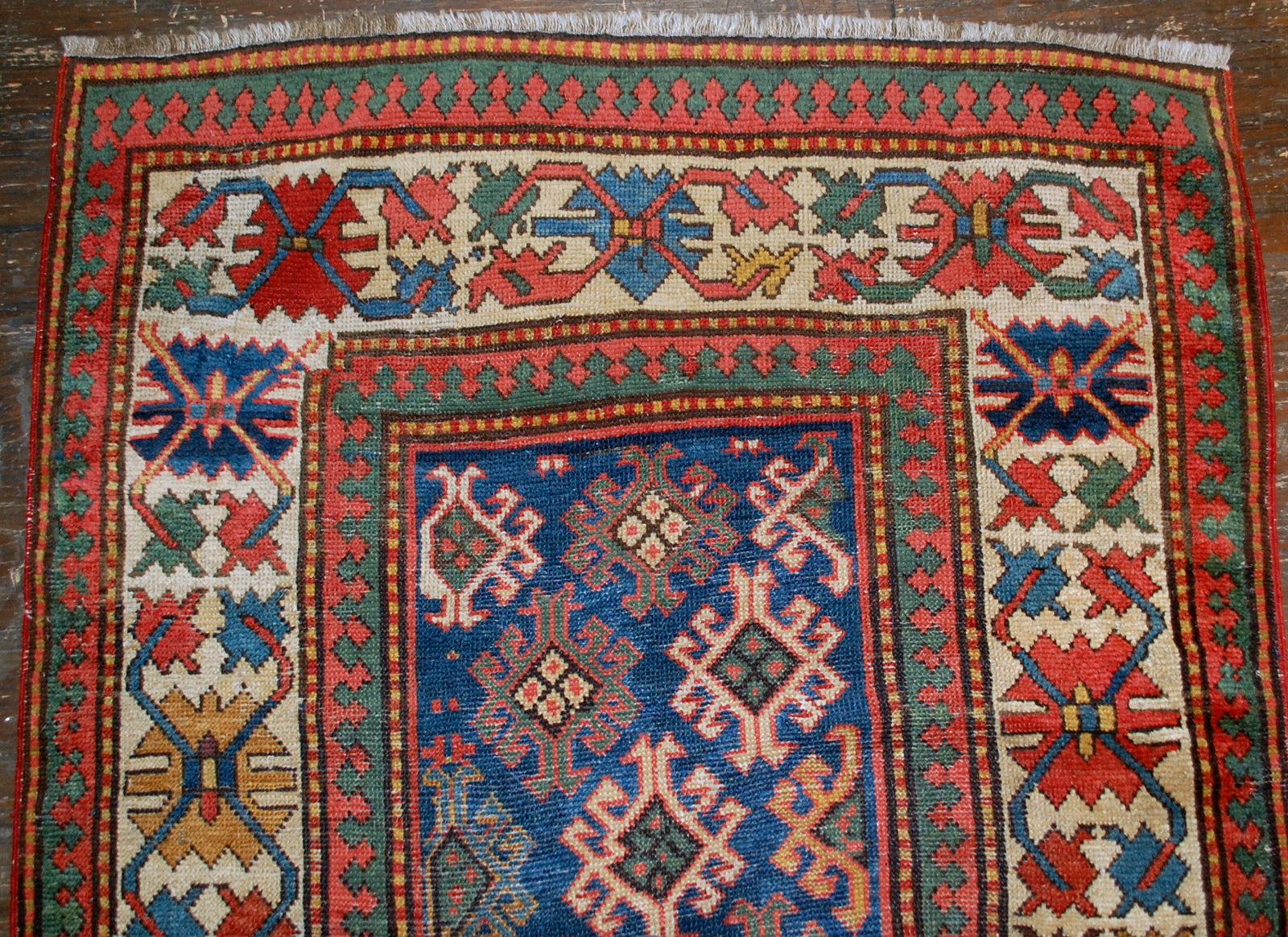 Antique handmade Caucasian Gendje rug in good condition. The rug is from the end of 19th century, made in Russia.