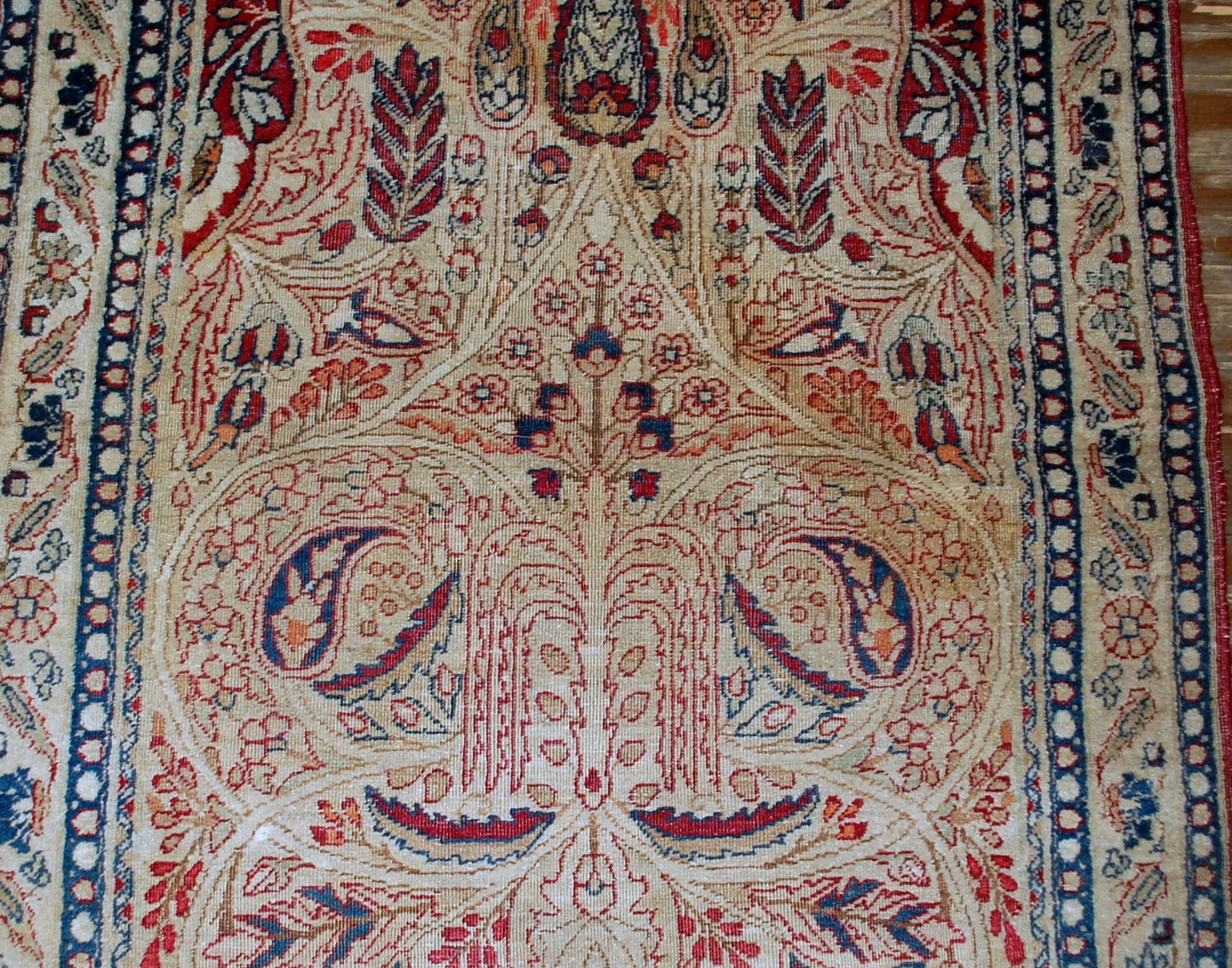 Persian Kerman Lavar rug in original condition, it has some low pile. The rug is prayer in beige and burgundy shades, made in the end of 19th century.