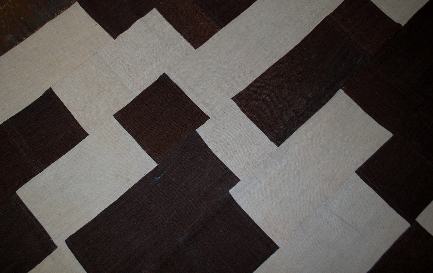 Handmade vintage Turkish kilim Patchwork in original good condition from the end of 20th century. This kilim made in white and chocolate brown wool.