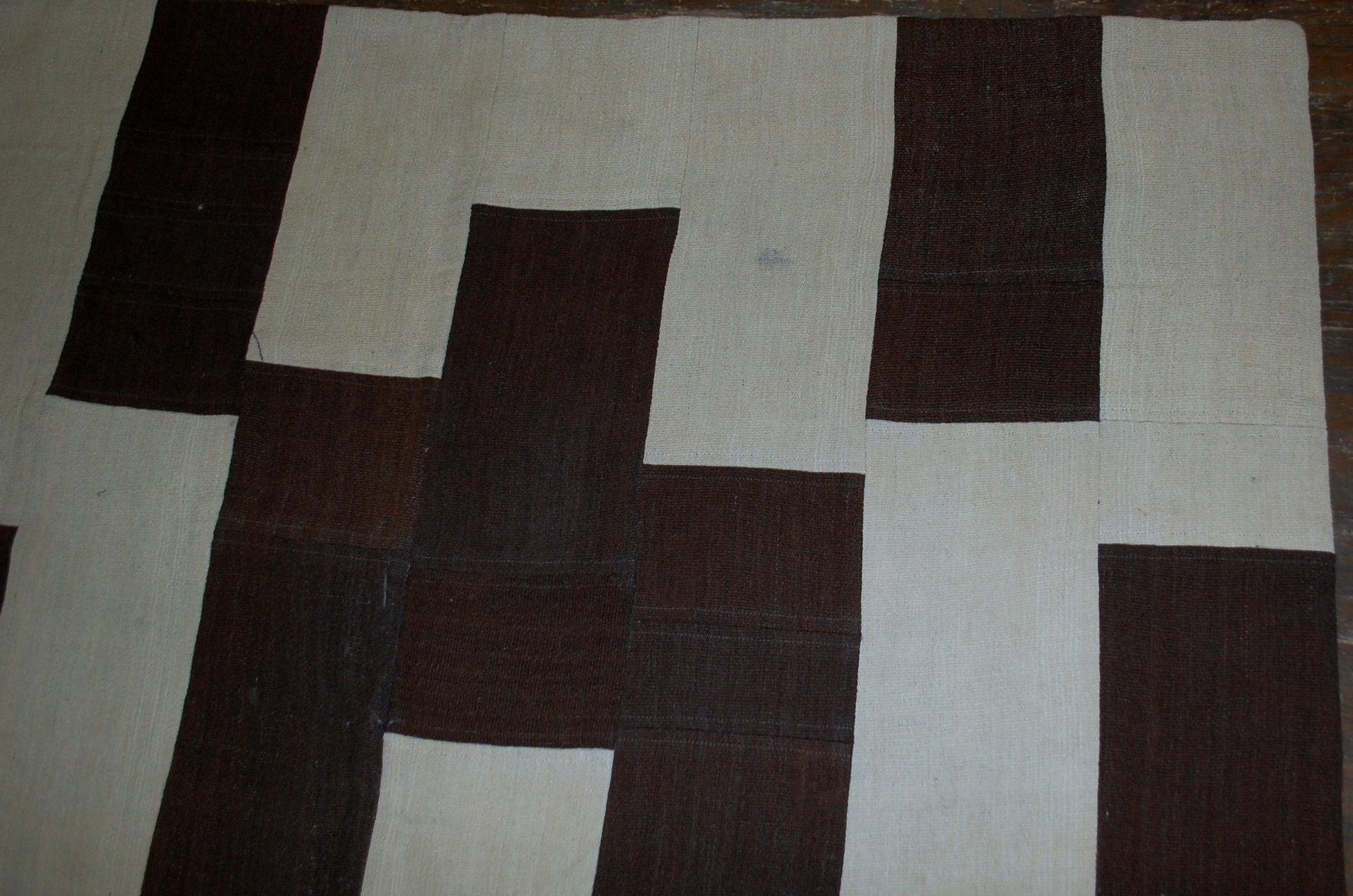 Handmade vintage Turkish kilim Patchwork in original good condition from the end of 20th century. This kilim made in white and chocolate brown wool.