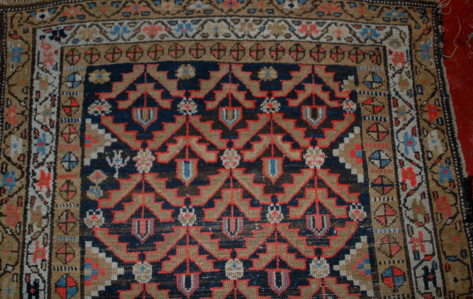 Antique Persian Hamadan rug in original condition, it has some low pile. The rug is from the Middle East region made in the beginning of 20th century.