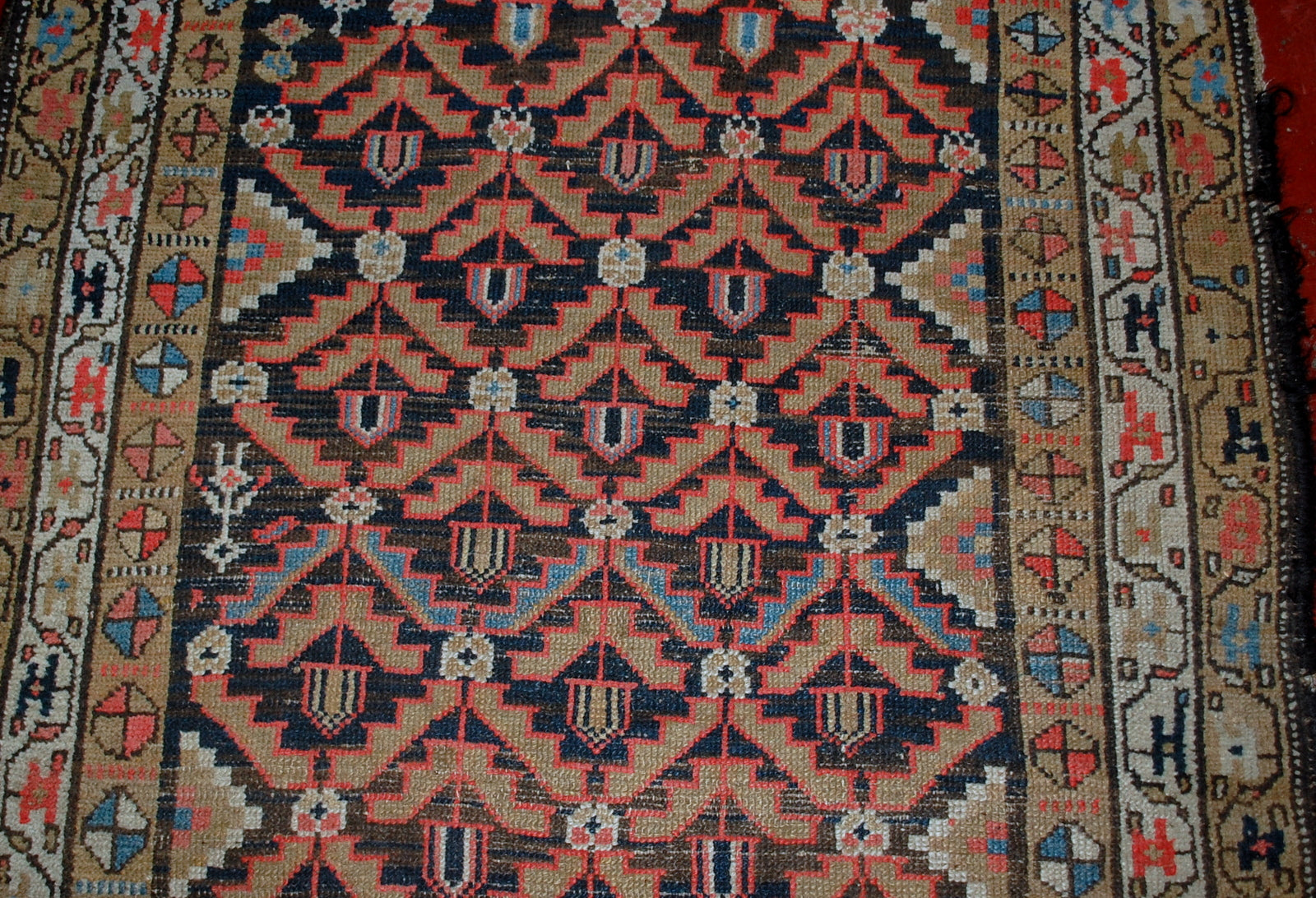 Antique Persian Hamadan rug in original condition, it has some low pile. The rug is from the Middle East region made in the beginning of 20th century.