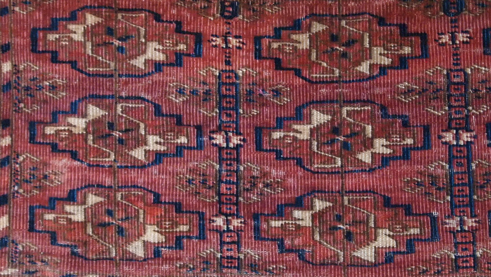 Antique Turkmen Tekke Torba in unusually small size. It is from the middle of 19th century, has some low pile.