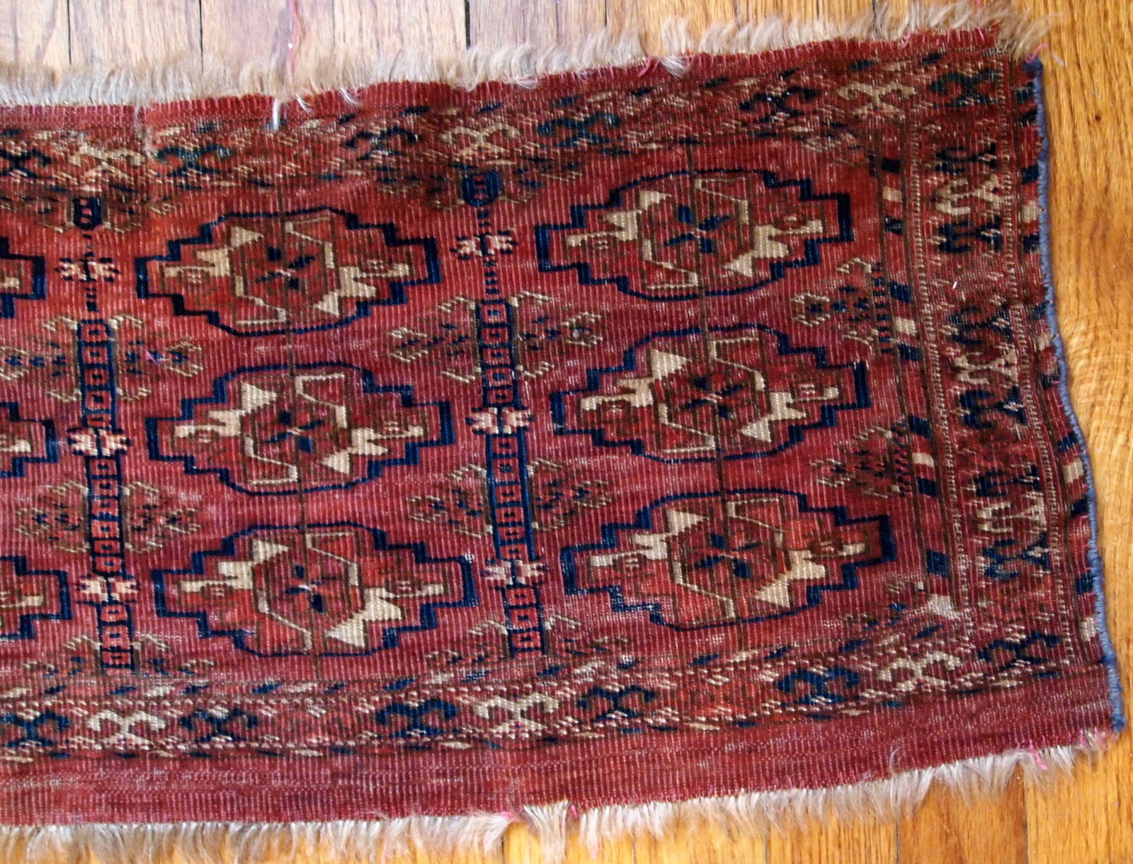 Antique Turkmen Tekke Torba in unusually small size. It is from the middle of 19th century, has some low pile.