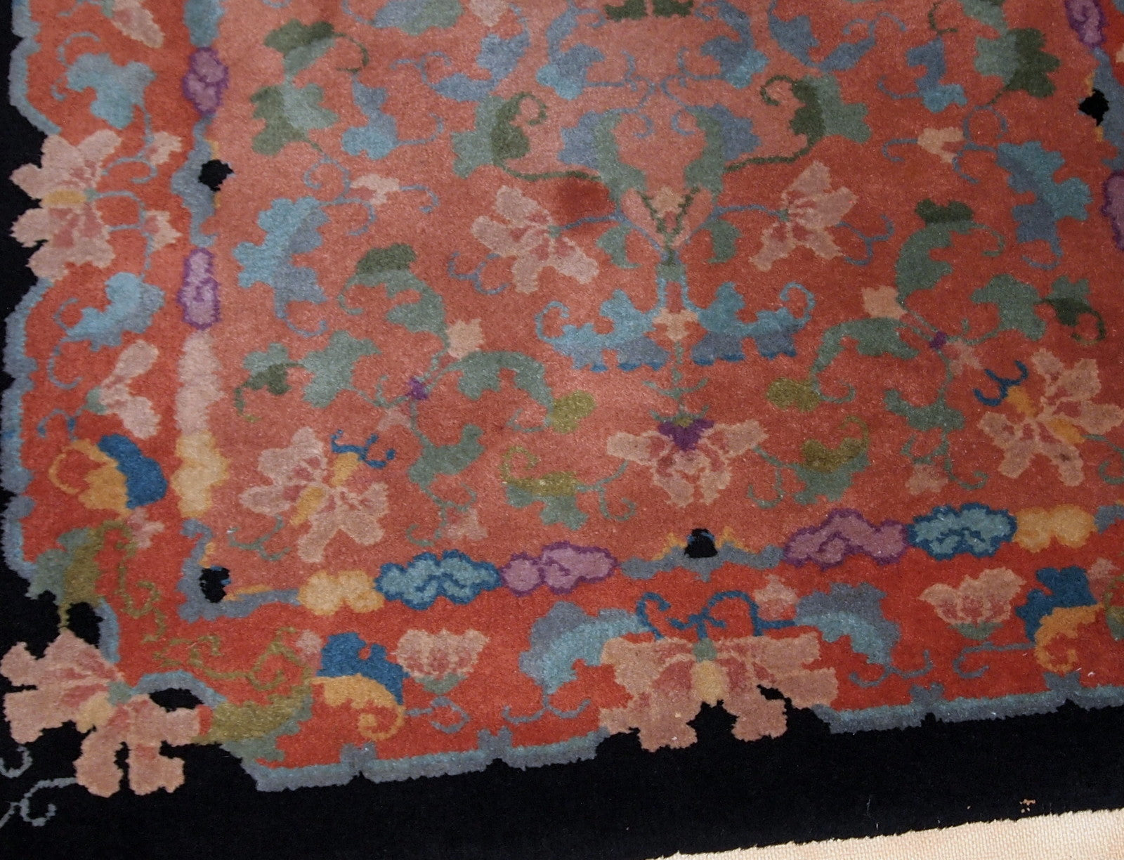 Antique Art Deco Chinese rug in unusual abstract design in  peach, sky blue, purple and egg shell shades. The rug is in original good condition.