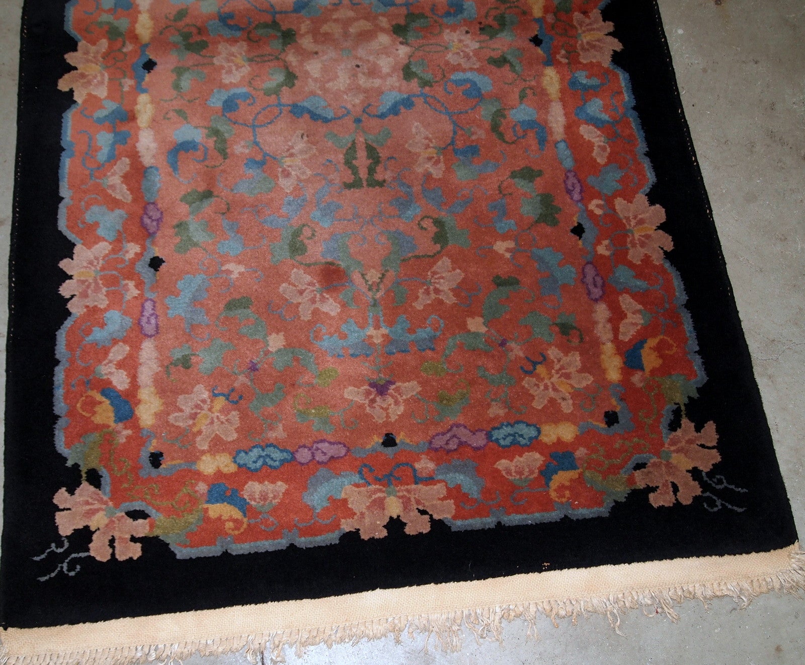 Antique Art Deco Chinese rug in unusual abstract design in  peach, sky blue, purple and egg shell shades. The rug is in original good condition.