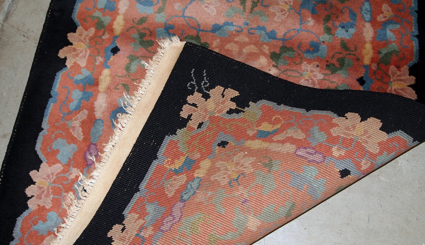 Antique Art Deco Chinese rug in unusual abstract design in  peach, sky blue, purple and egg shell shades. The rug is in original good condition.