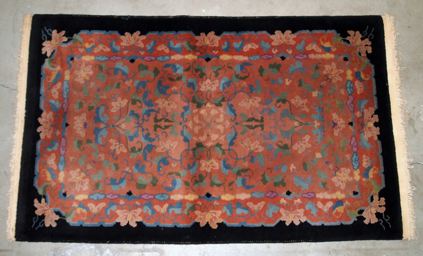 Antique Art Deco Chinese rug in unusual abstract design in  peach, sky blue, purple and egg shell shades. The rug is in original good condition.