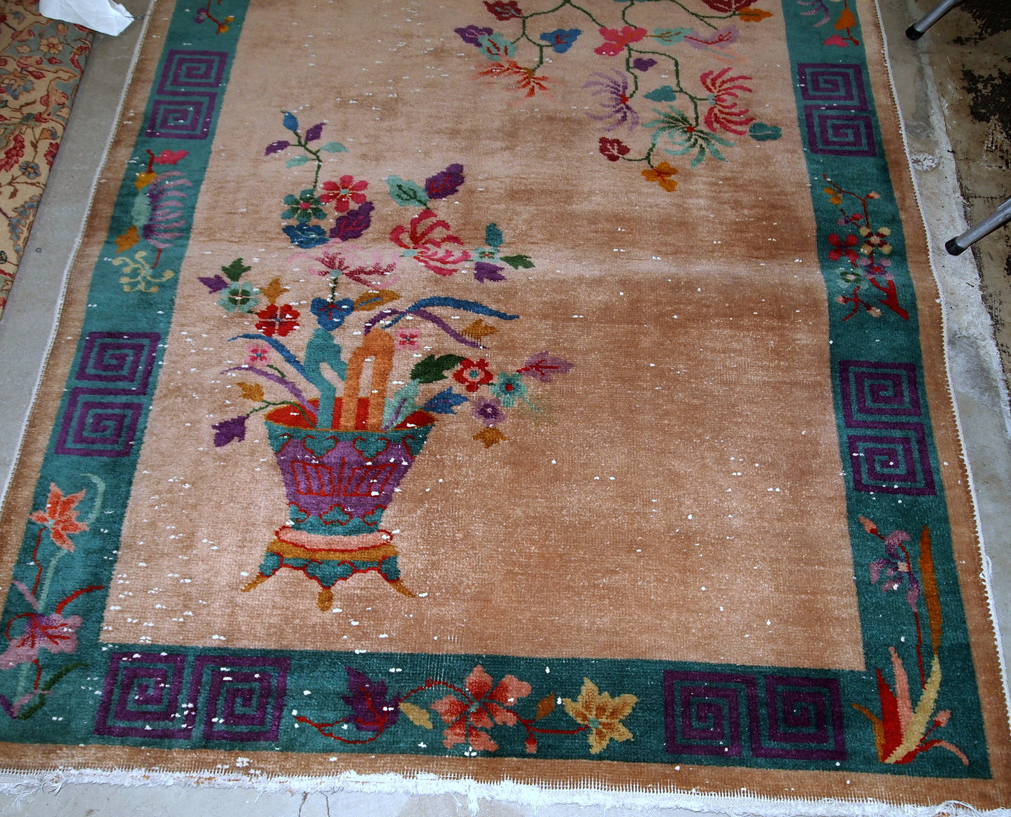 Handmade antique Art Deco Chinese rug in peach shade and decorative vase design. The rug is in original condition.