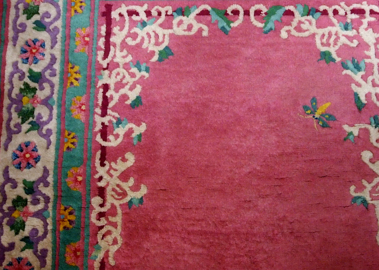 Handmade vintage Art Deco Chinese rug in fuchsia color and with all-over design. The rug is from 1930s, in original good condition.
