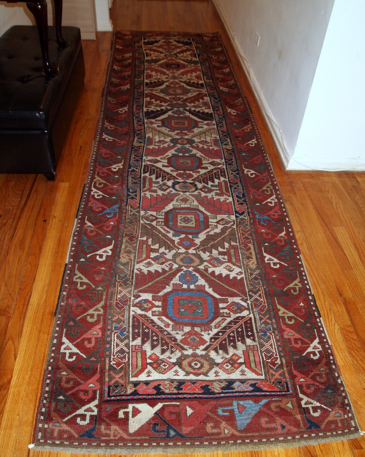 Hand made antique collectible Northwest Persian runner in original good condition. This rug is from the middle of 19th century in white, burgundy, blue and yellow shades.