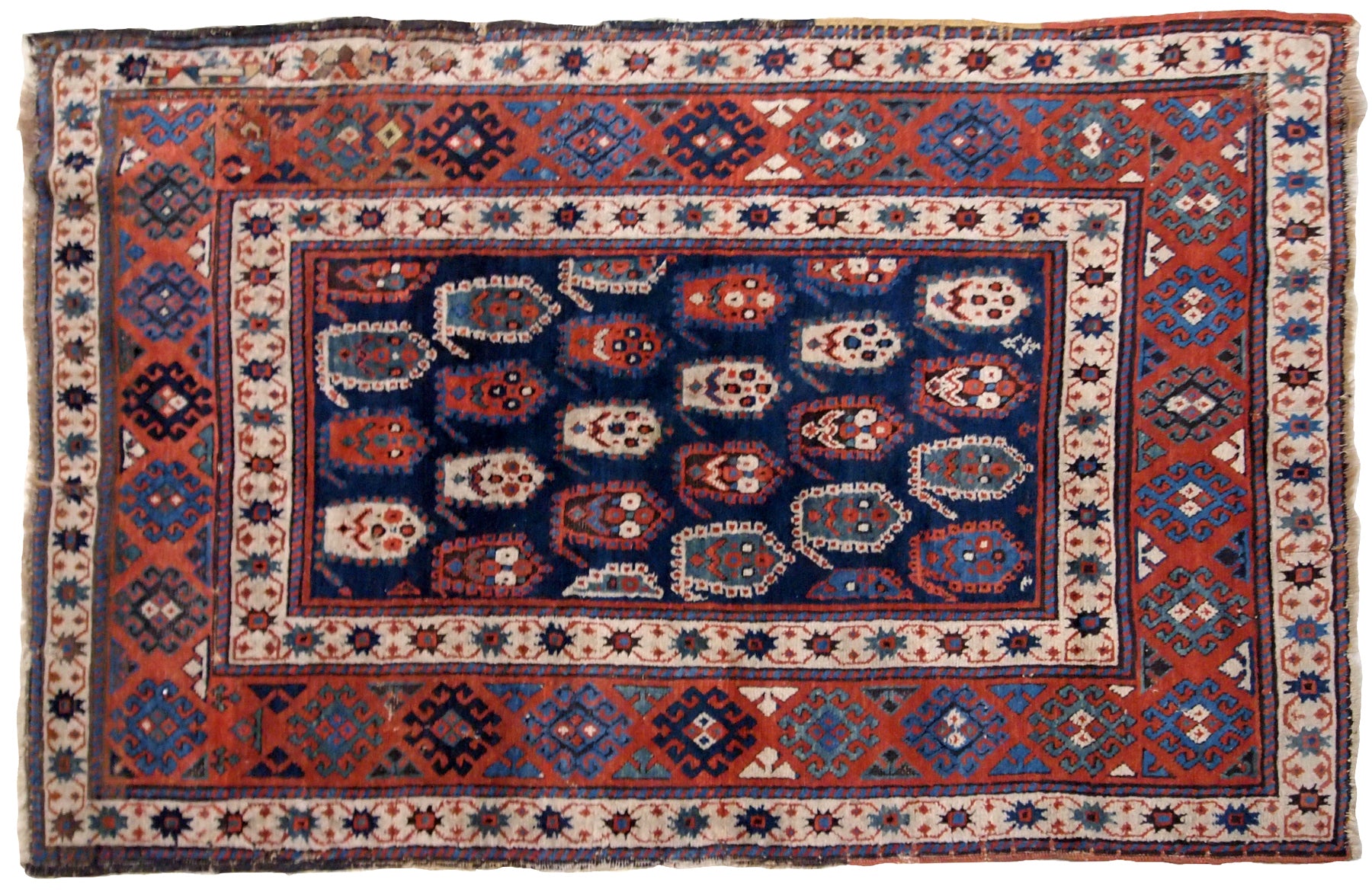Handmade antique Caucasian Kazak rug in original good condition. This rug is from the end of 19th century made in unusual design.