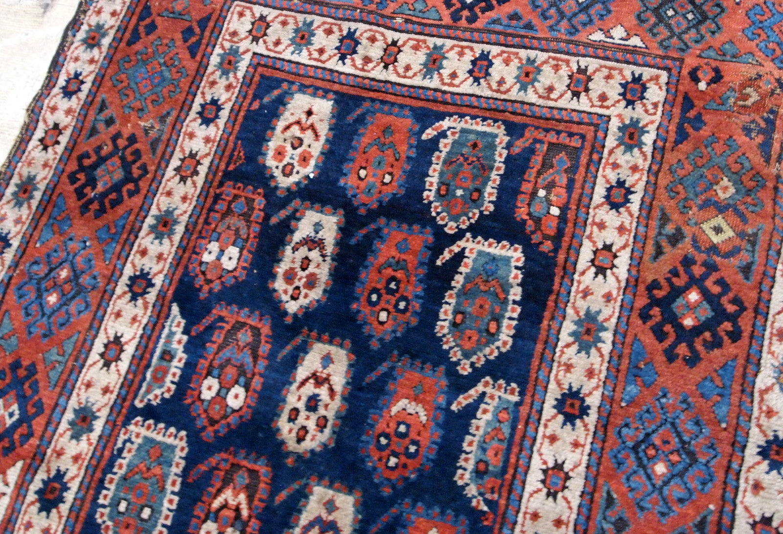 Handmade antique Caucasian Kazak rug in original good condition. This rug is from the end of 19th century made in unusual design.