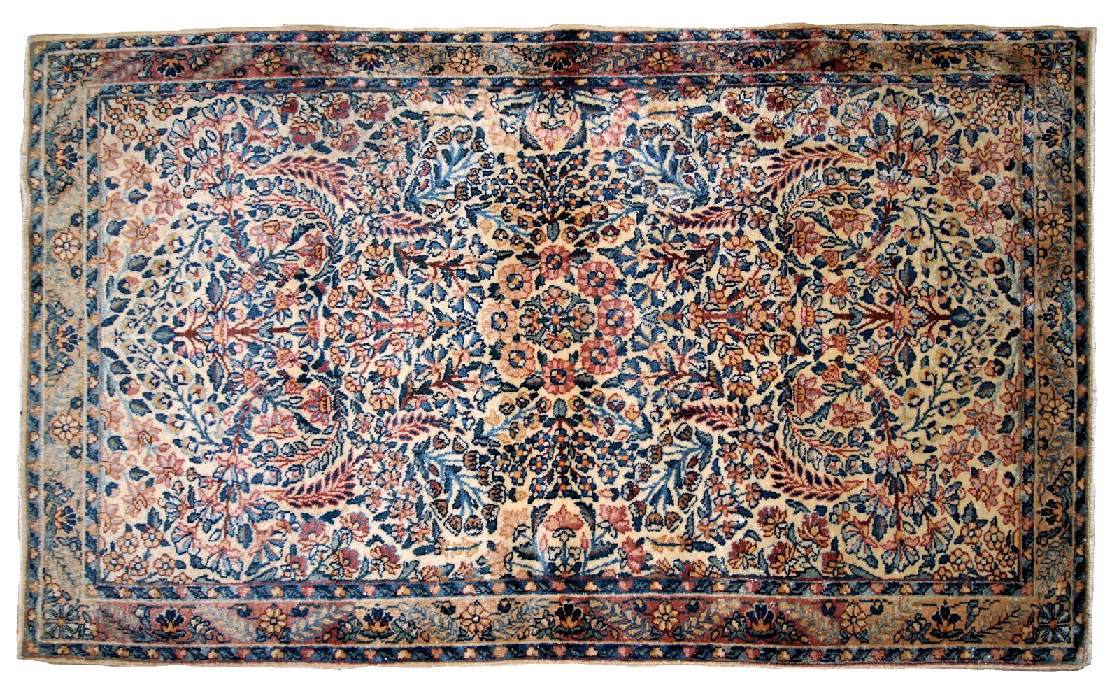 Hand made antique Kerman rug in original good condition from the beginning of 20th century. The rug in in beige shade and with classic floral design.
