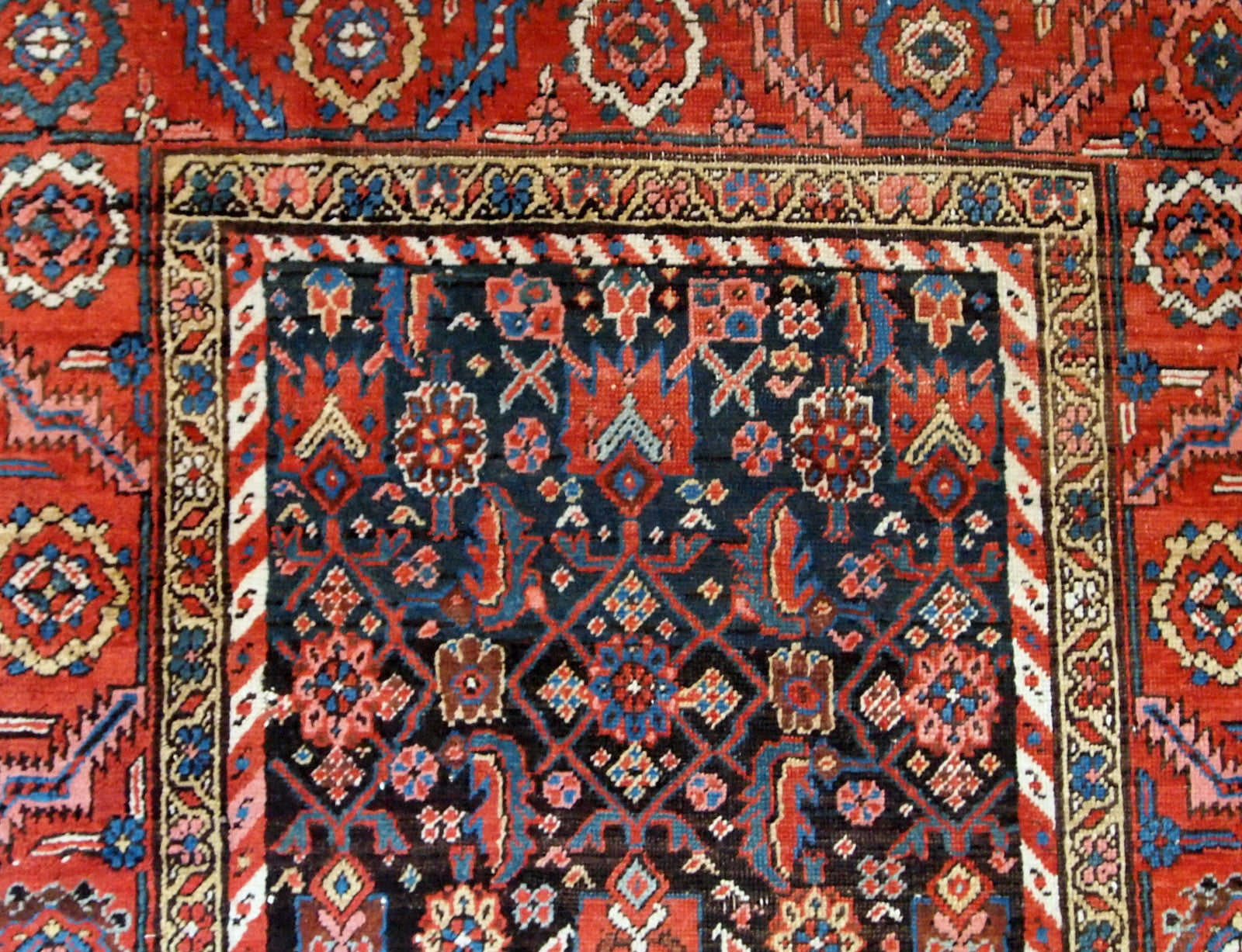 Handmade antique Bakhsaish runner in chocolate brown, red and blue shades. It is from the end of 19th century in good condition.