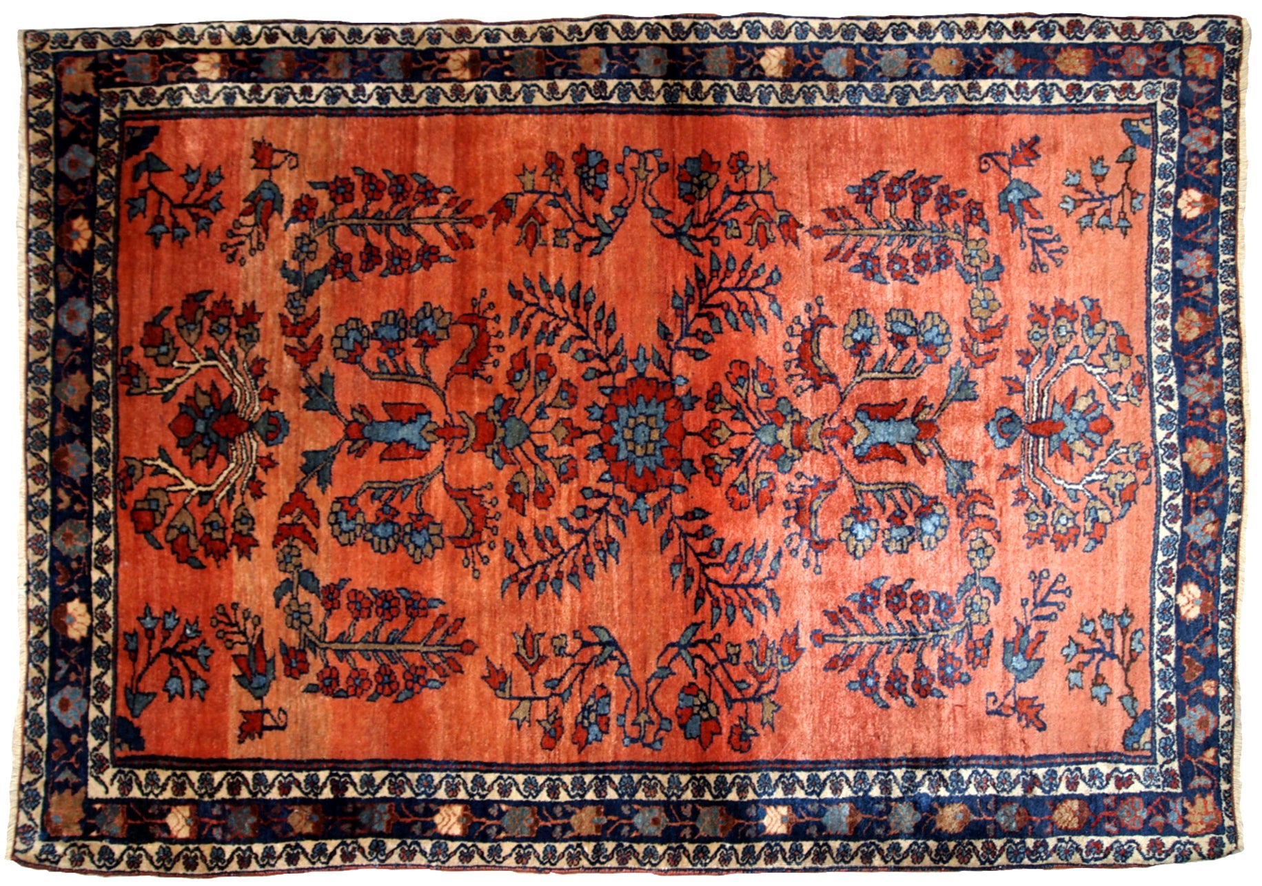Hand made antique Persian Sarouk rug in red wool. The rug is from the beginning of 20th century in original good condition.