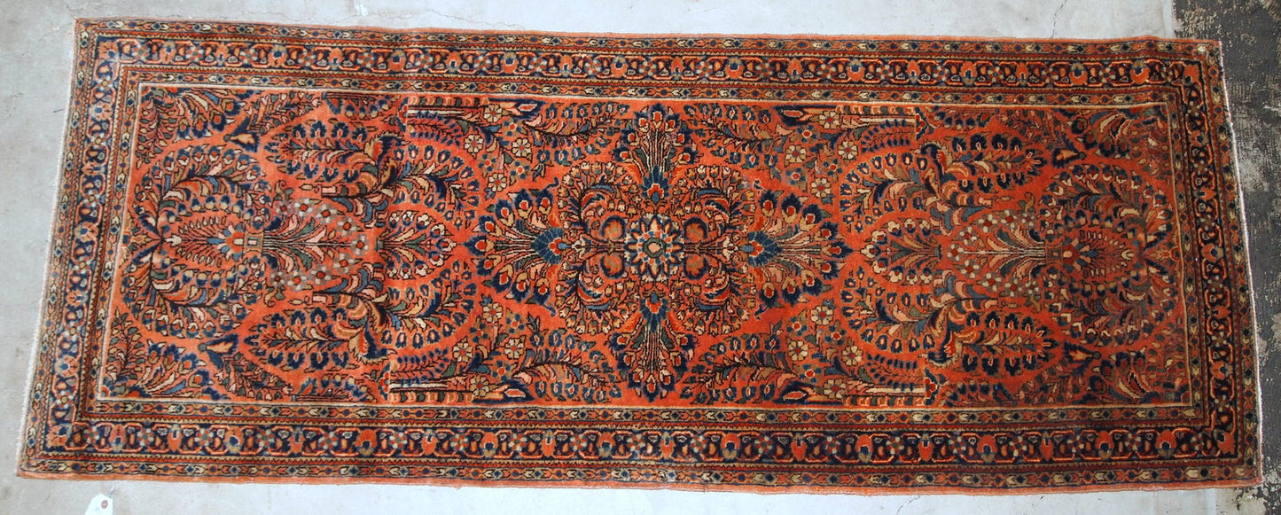 Antique Persian Sarouk rug in original good condition. The rug is from the beginning of 20th century, made in red wool.