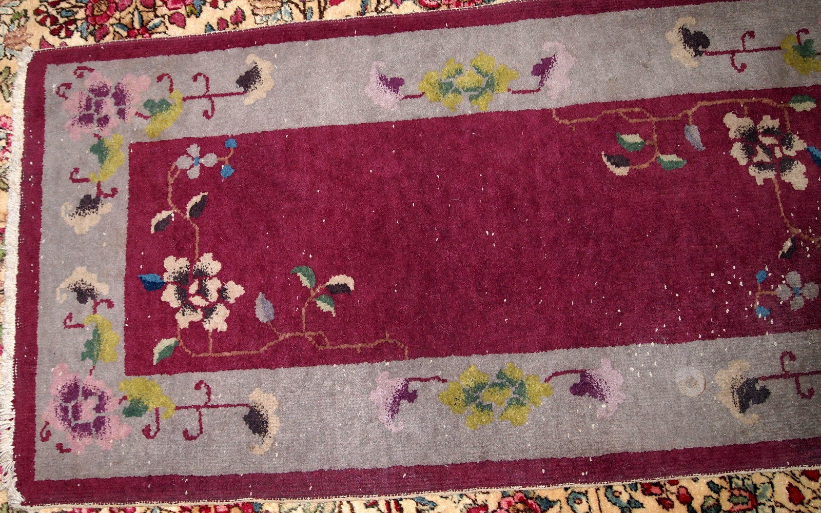 Antique Art Deco Chinese rug in Bordeaux and silver shades. The rug is from 1920s in original good condition.