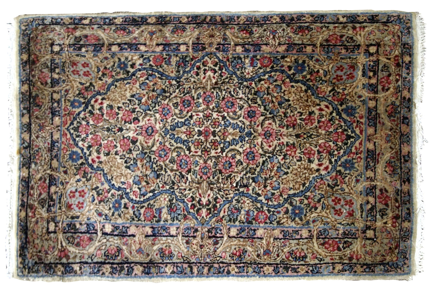 Antique Persian Kerman floral rug in colorful shades. The rug is from the beginning of 20th century in original good condition.