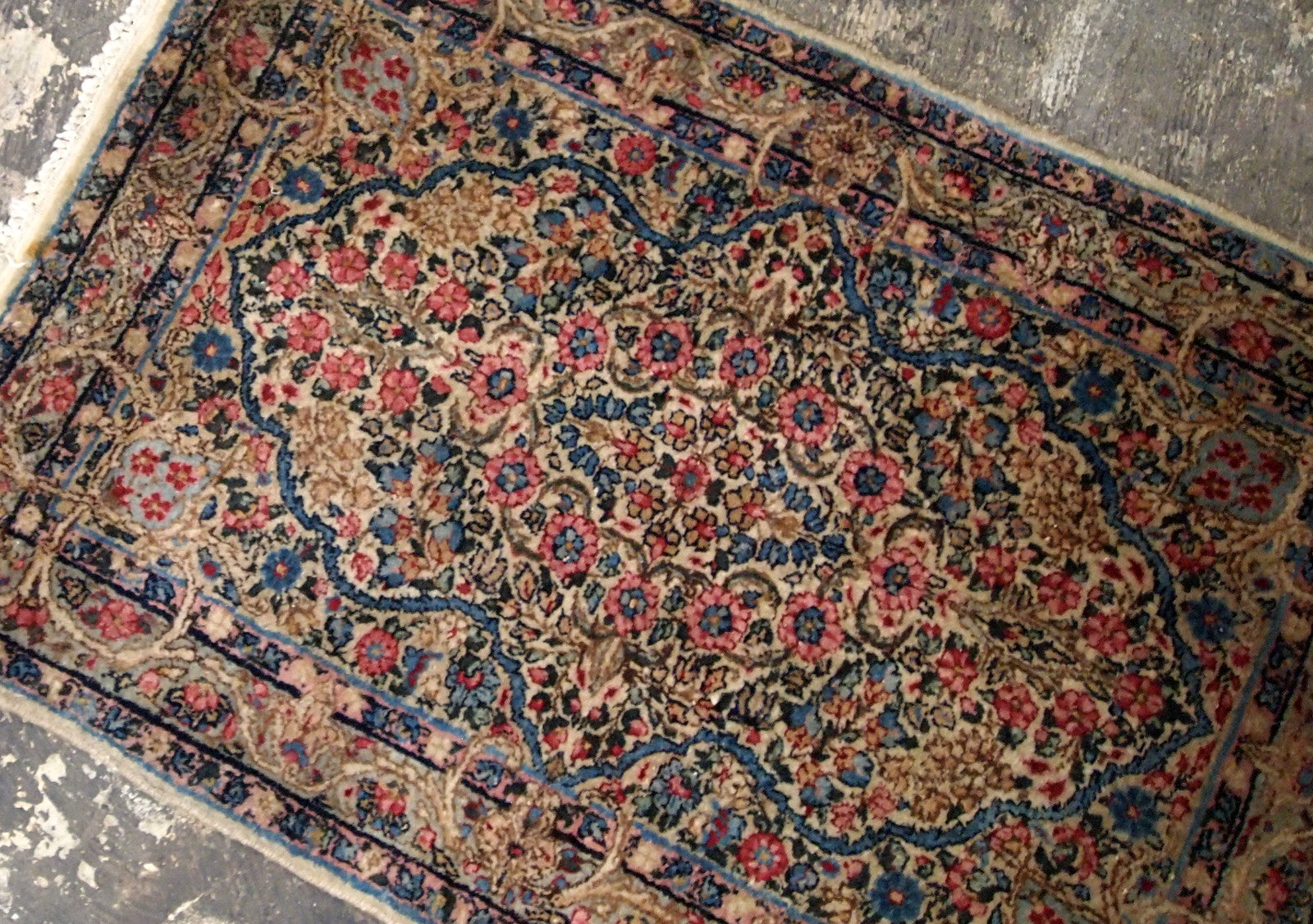 Antique Persian Kerman floral rug in colorful shades. The rug is from the beginning of 20th century in original good condition.
