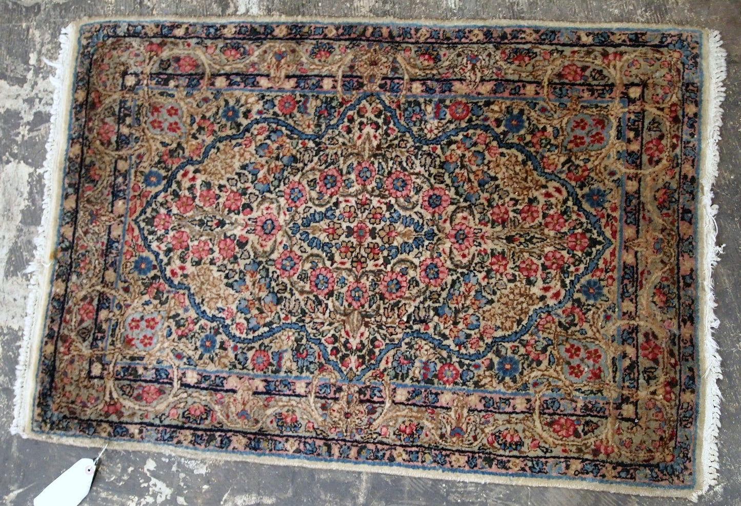 Antique Persian Kerman floral rug in colorful shades. The rug is from the beginning of 20th century in original good condition.
