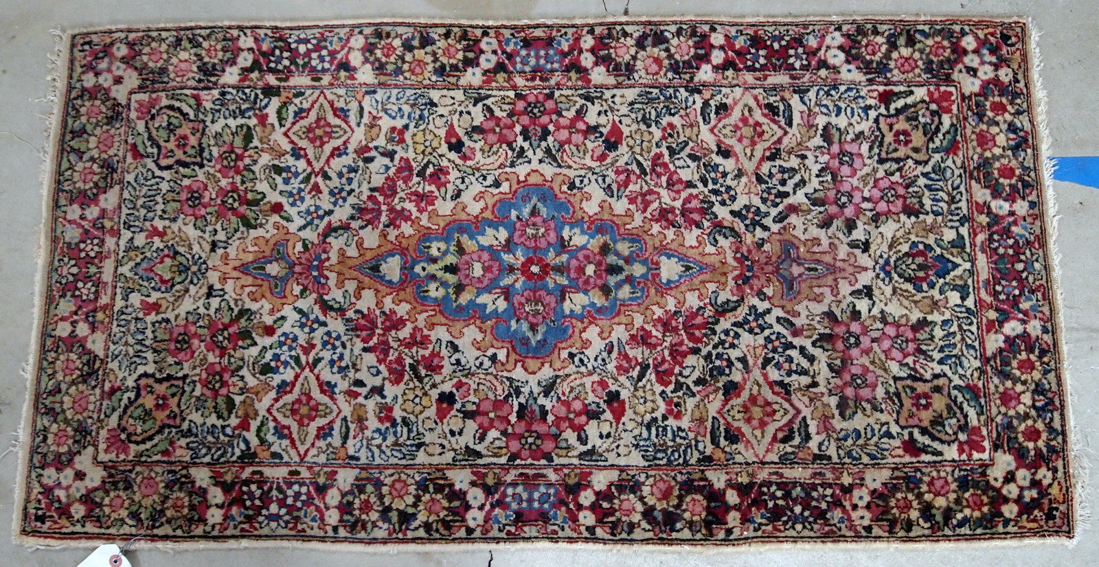 Antique handmade Persian Kerman rug in colorful shades. It is from the beginning of 20th century in original good condition.