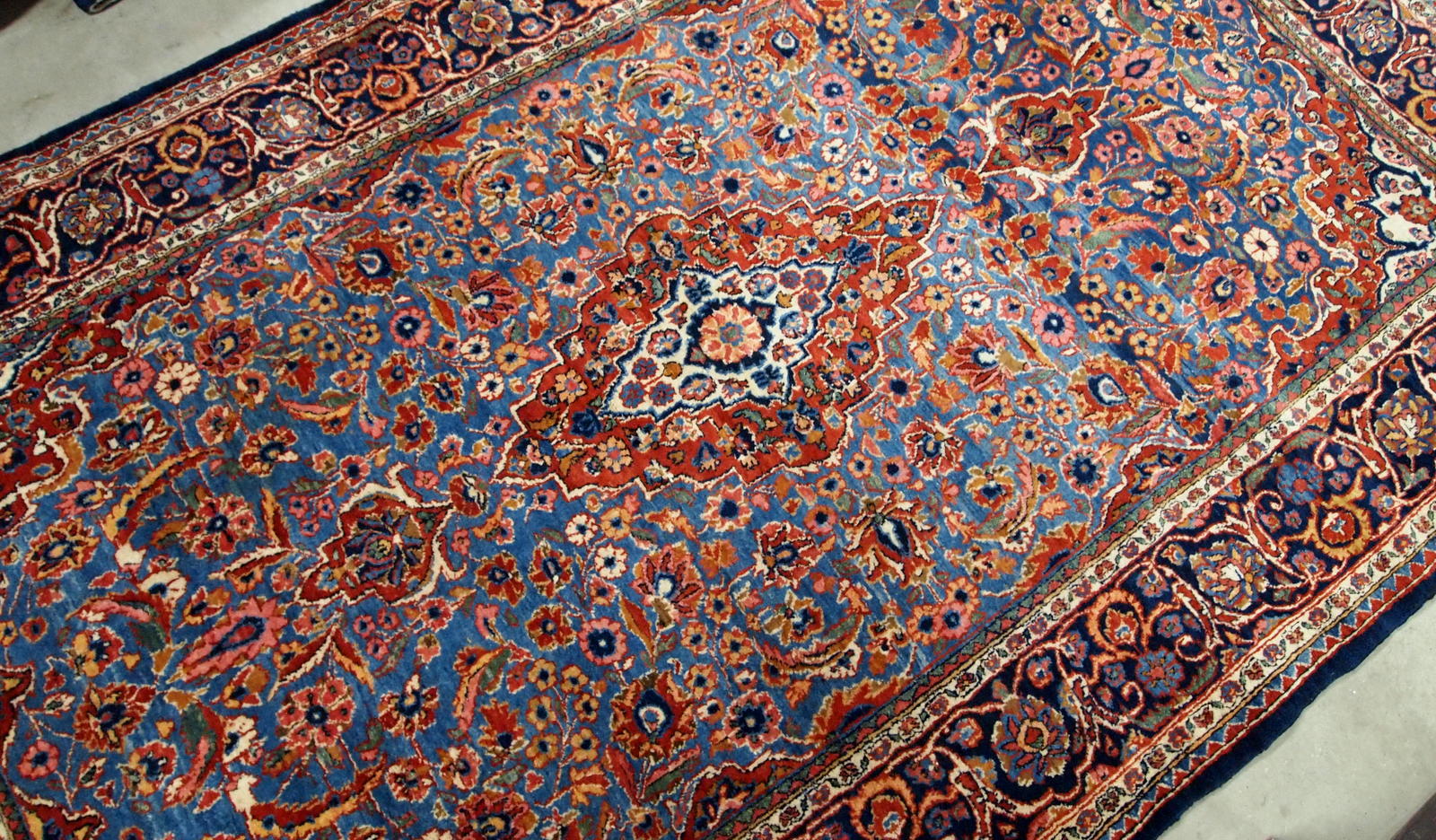 Antique Persian hand made Kashan rug in sky blue color. The rug is in original good condition from the beginning of 20th century.