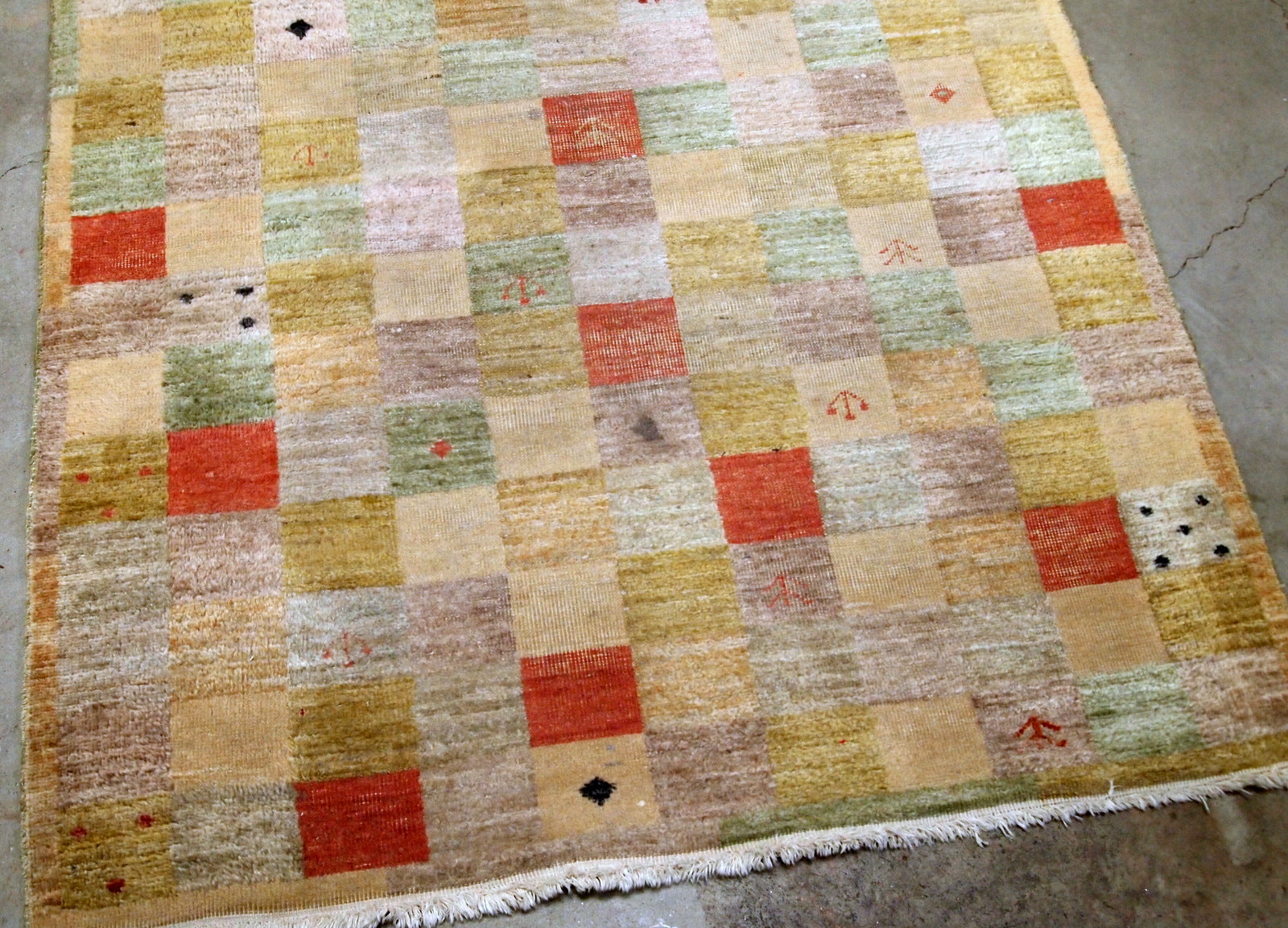 Vintage Chinese modern rug in colorful shades. The rug made in wool in the end of 20th century, it has some low pile due to age.