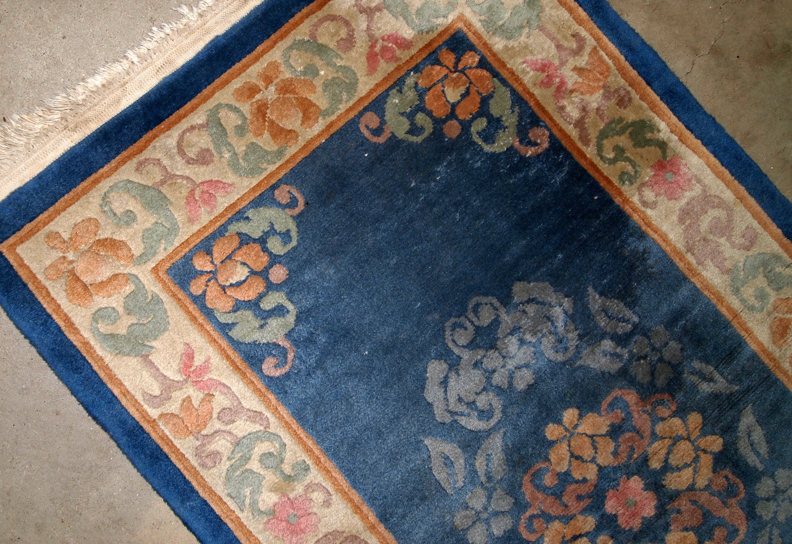 Antique handmade Art Deco Chinese rug in blue shade and traditional floral design. The rug is from 1960s in original good condition.