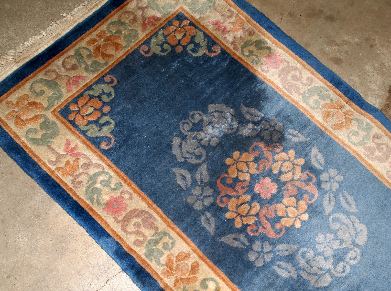 Antique handmade Art Deco Chinese rug in blue shade and traditional floral design. The rug is from 1960s in original good condition.