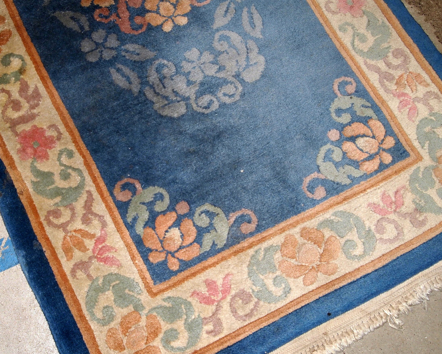 Antique handmade Art Deco Chinese rug in blue shade and traditional floral design. The rug is from 1960s in original good condition.