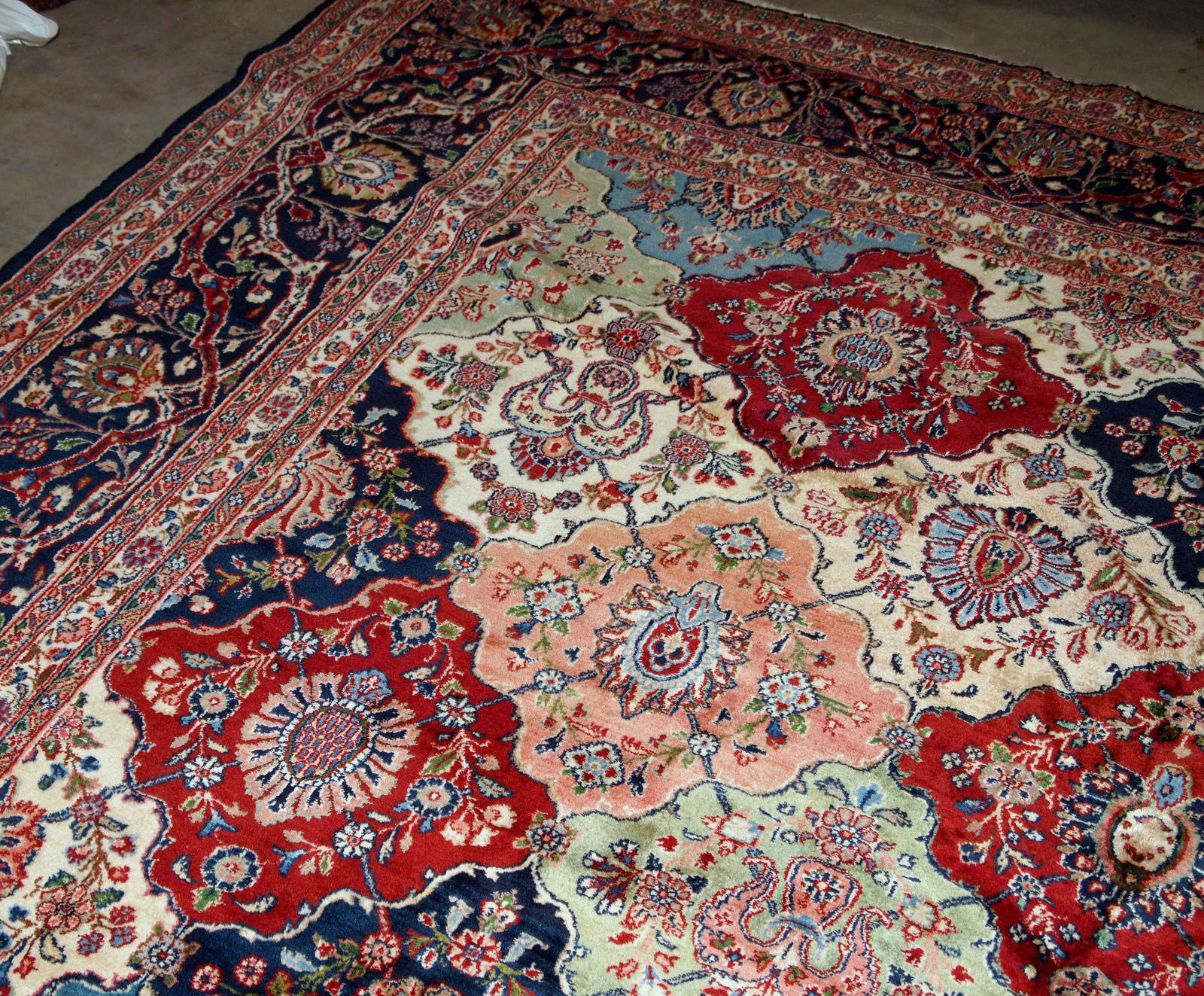 Antique Persian Kashan rug in colourful shades. The rug is in good condition, made in the beginning of 20th century.